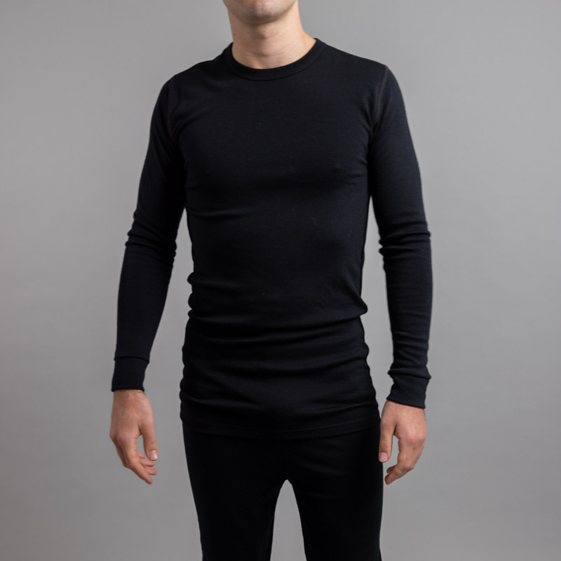 Front view of a male wearing black Merino Skins – Unisex Long Sleeve Crew Neck