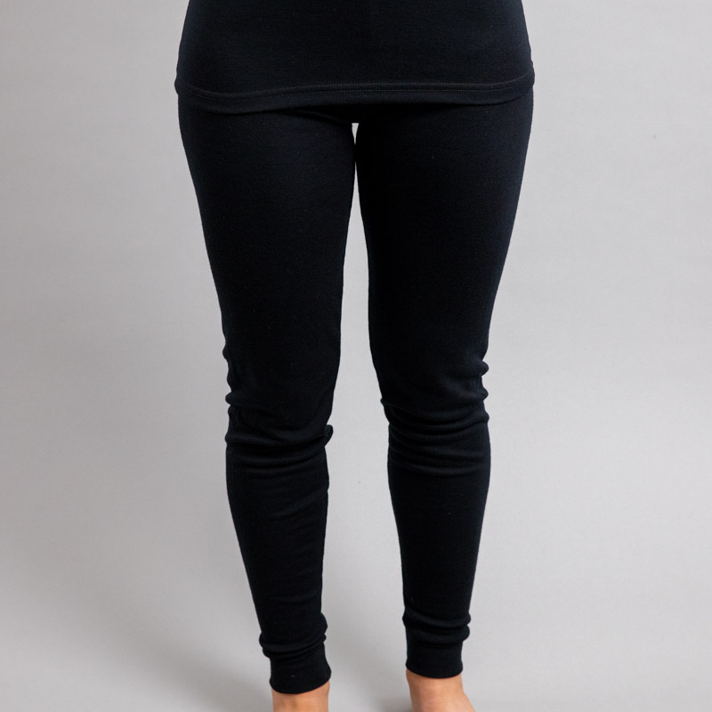 Front view of a female wearing black Merino Skins - Unisex Long John / Pant