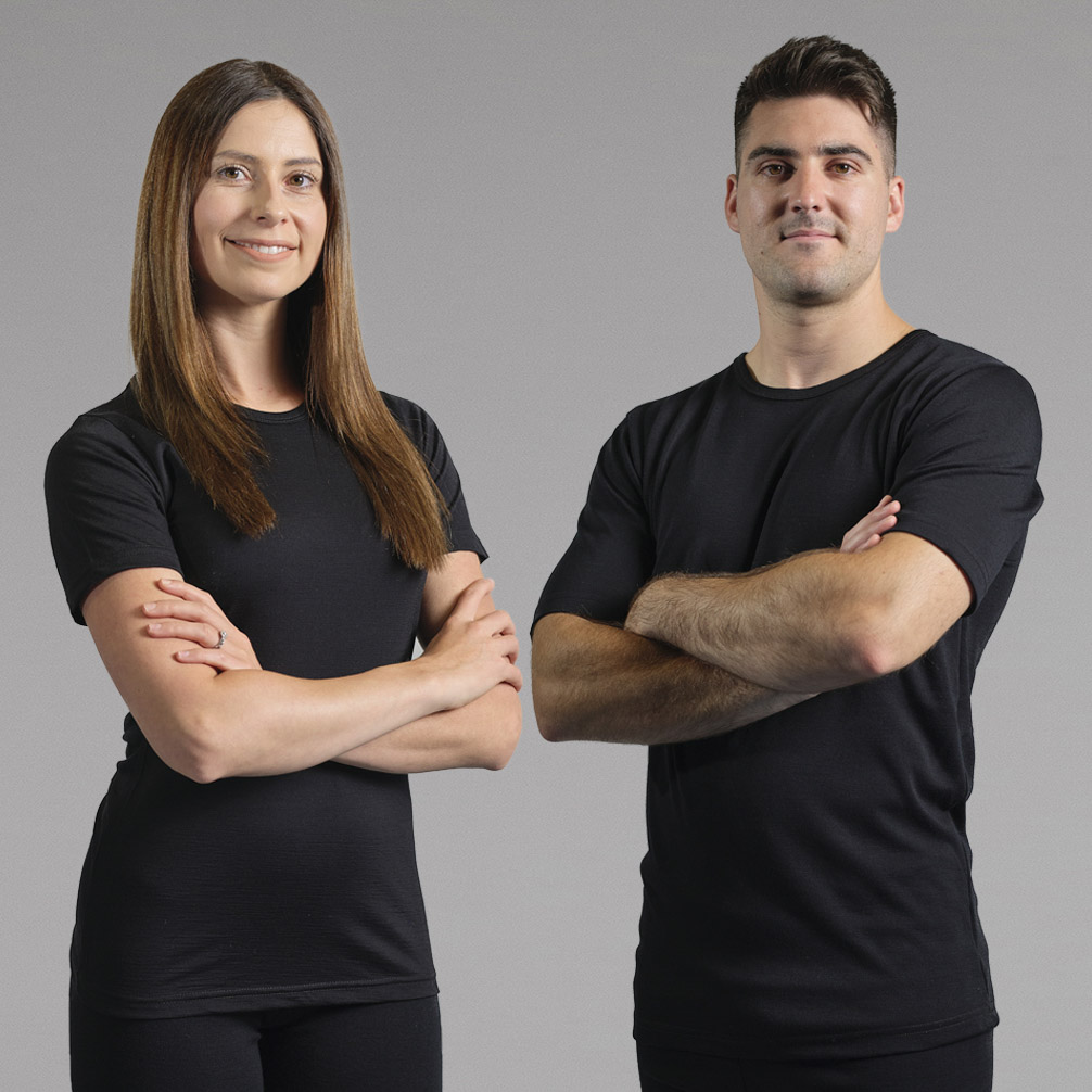 a couple wearing Merino Skins Lite t shirts