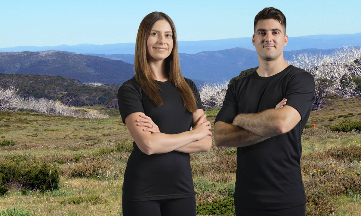 a hiking couple wearing Merino Skins Lite t shirts